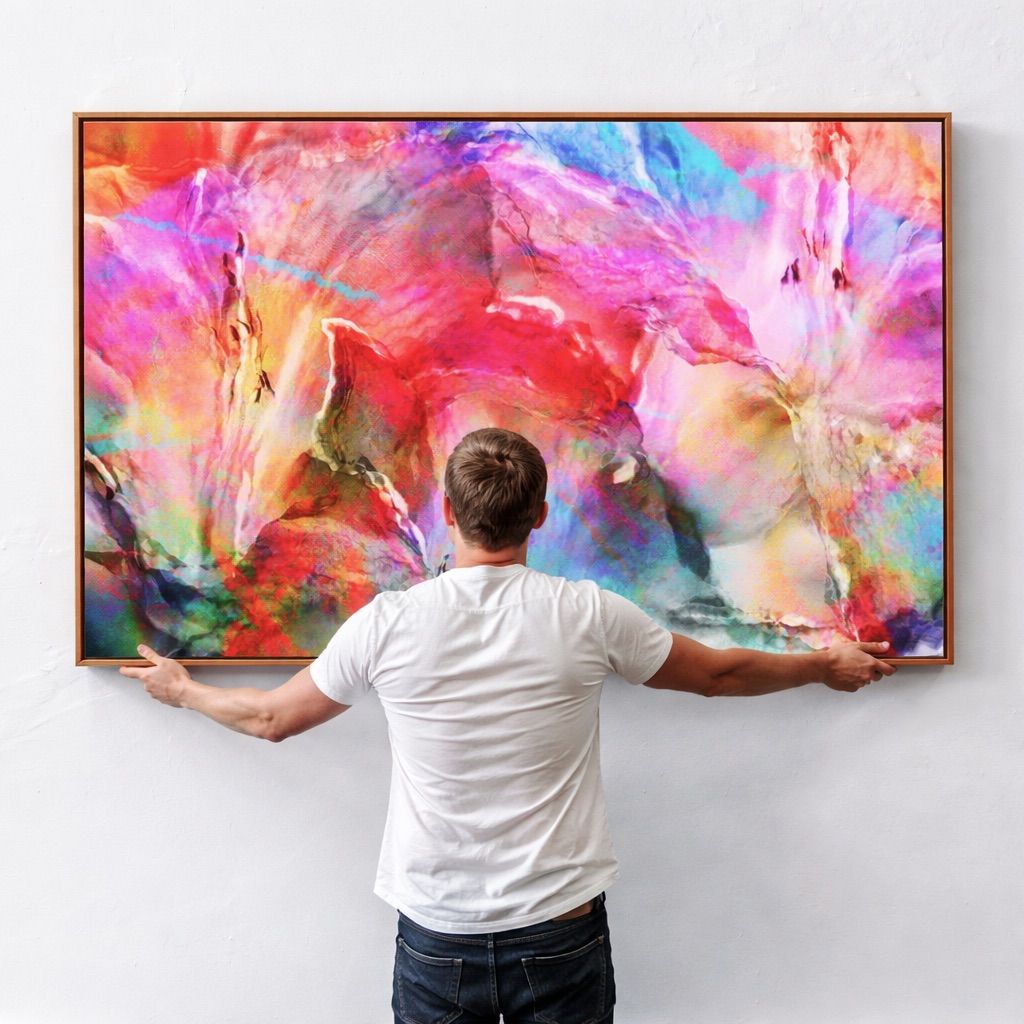 adjusting newly hung modern wall art