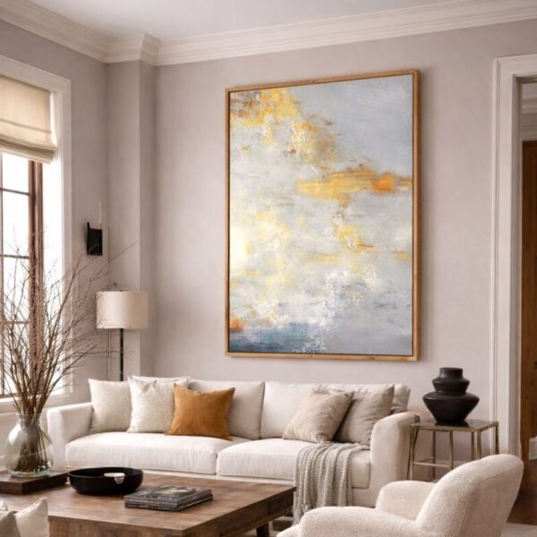 oversized statement canvas wall art above sofa in living room